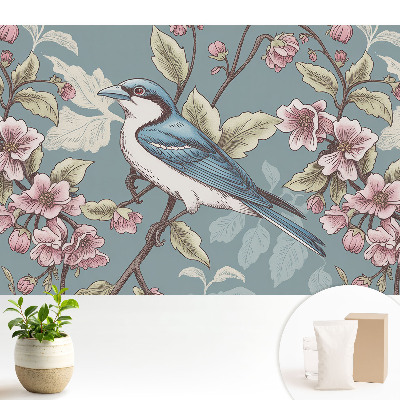 O pasăre și crengi de cireș înflorite