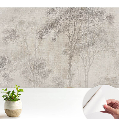 Copaci delicați pe fundal bej