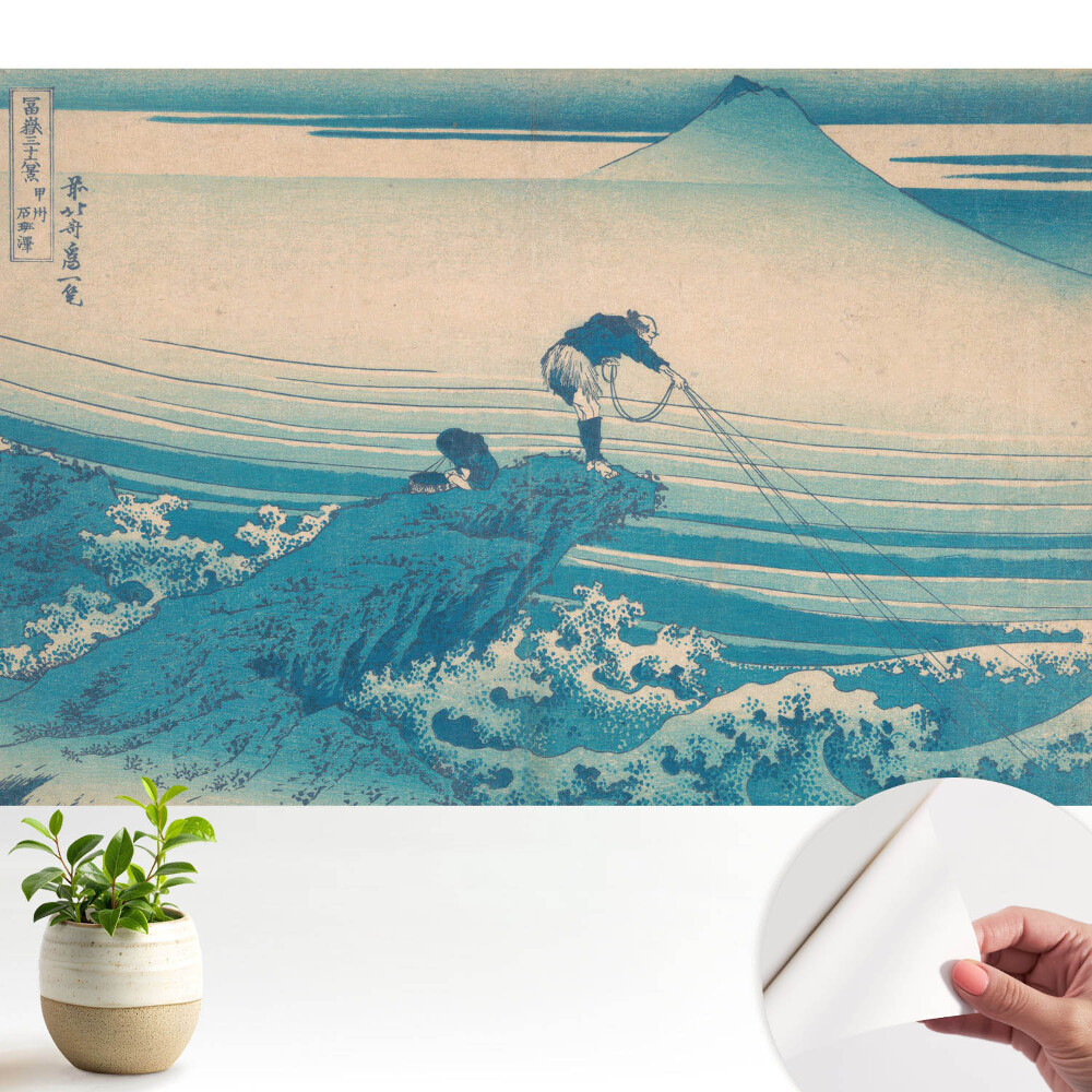 Pescari cu un munte în fundal.