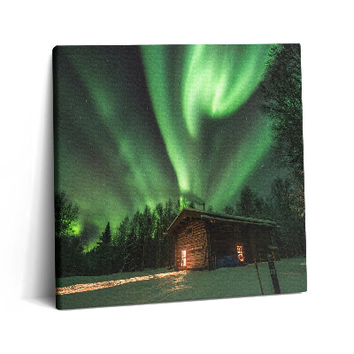 Tablou pe pânză canvas 60x60 Aurora boreală și o casă în pădure