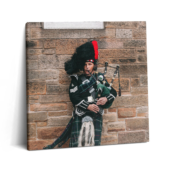 Tablou pe pânză canvas 60x60 Un muzician care cântă la cimpoi