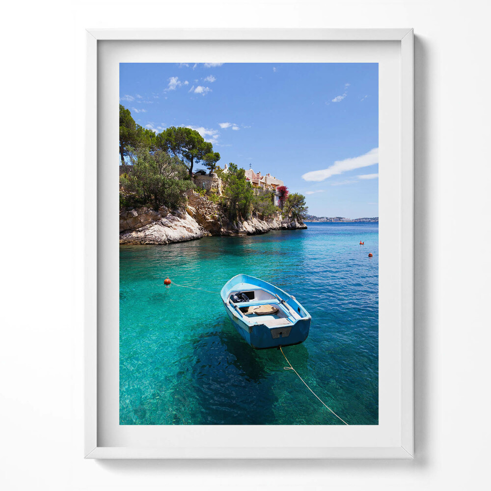 Tablou rama O barcă pe o mare turcoaz