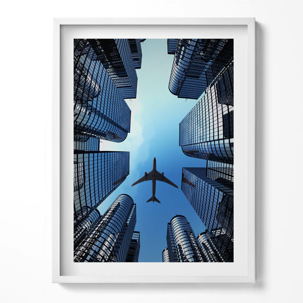 Tablou living cu rama Avion deasupra clădirilor