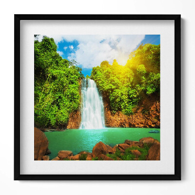 Tablou living cu rama unic Peisaj cu o cascadă printre verdeață