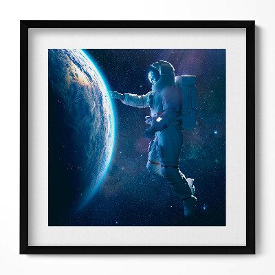 Tablou living cu rama unic Astronautul și Planeta Pământ