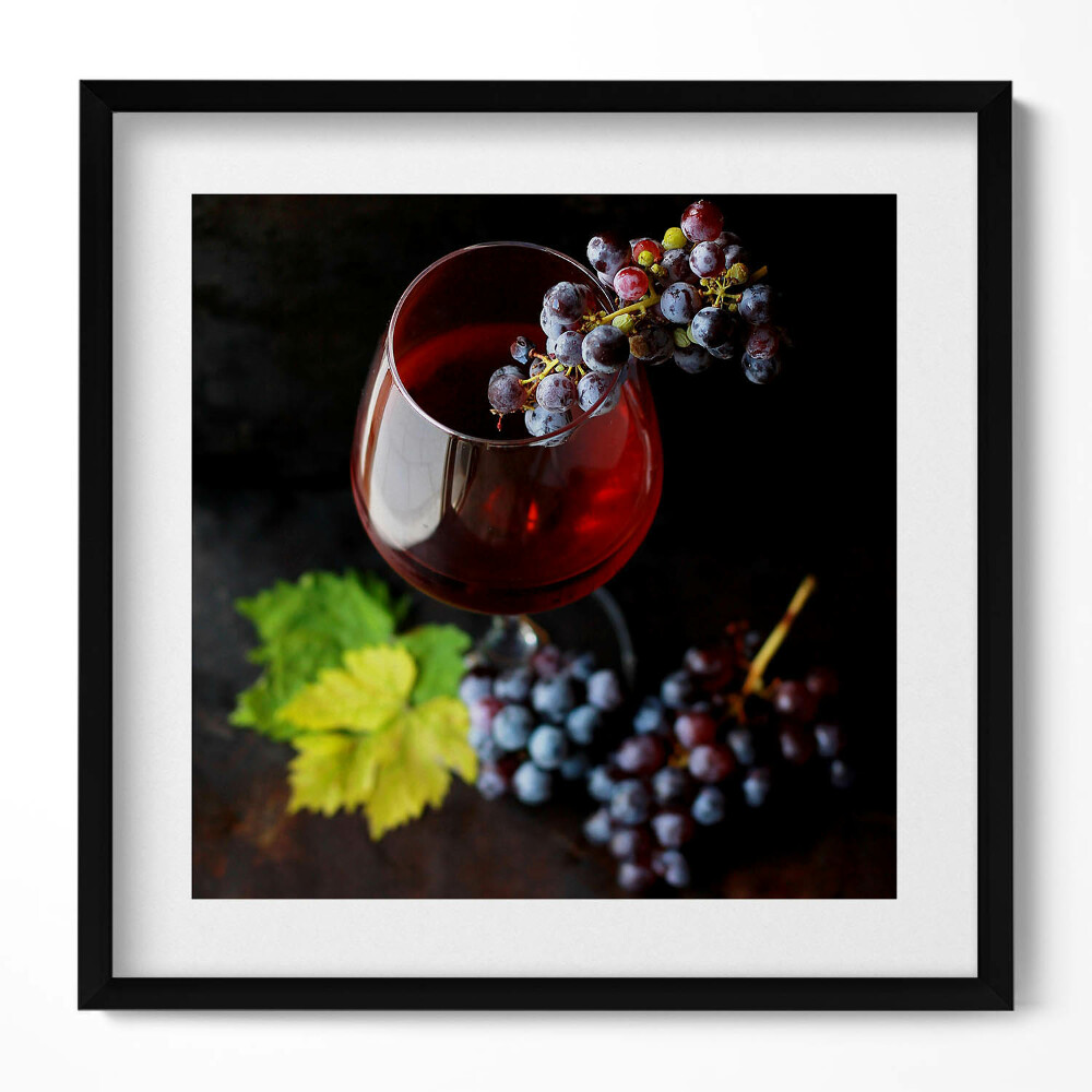 Tablou living cu rama unic Un pahar de vin și struguri