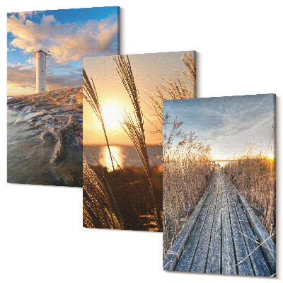 Set tablouri canvas triptic Vedere a farului de lângă mare, iarbă și un dig de lemn