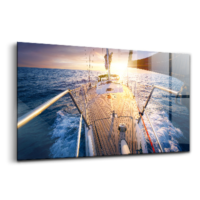 Tablou pe sticlă Apus de soare pe puntea unei bărci cu pânze