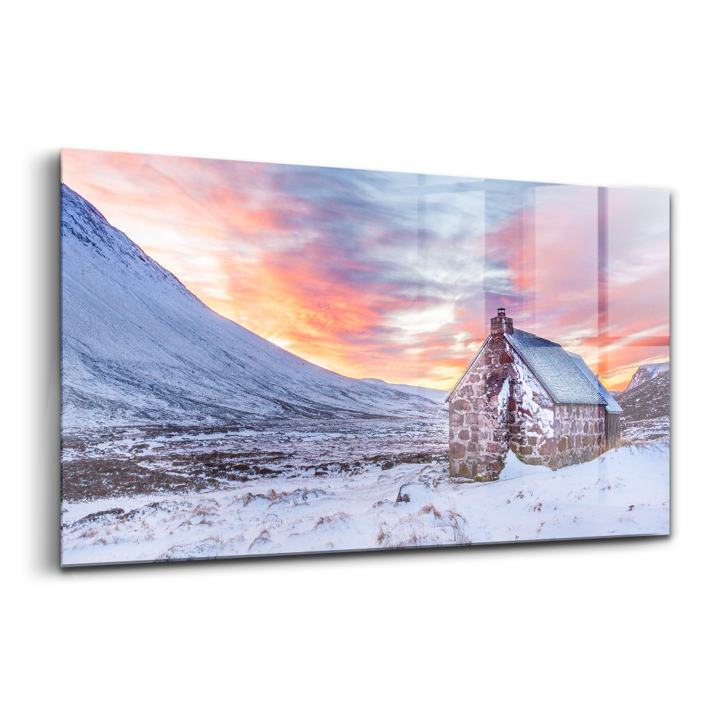 Tablou sticlă Căsuță în munții înzăpeziți